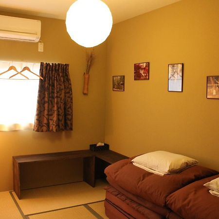 Bar And Hostel Mondo Osaka Bagian luar foto