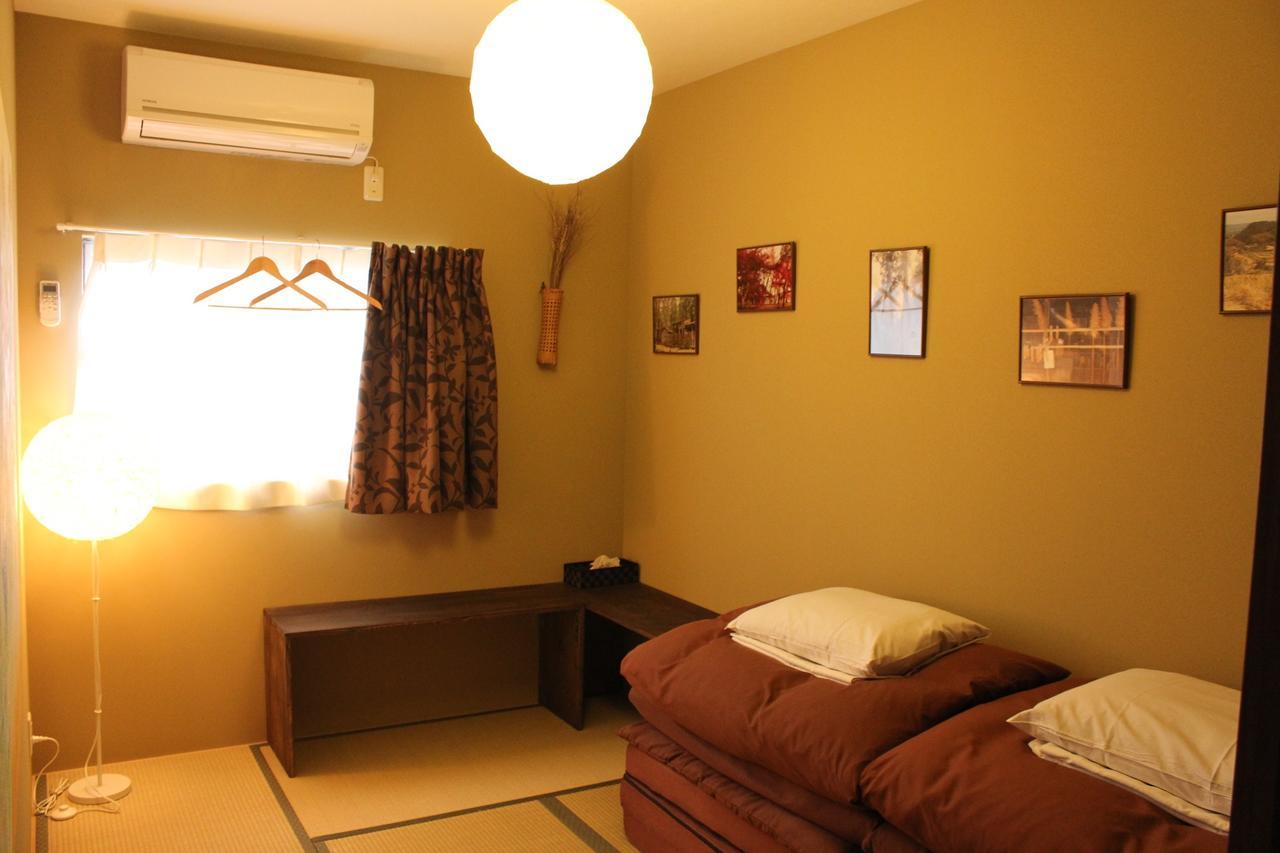 Bar And Hostel Mondo Osaka Bagian luar foto